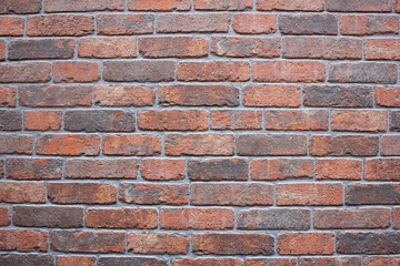 Obraz premium Modern brickwork.Red brickwork.Brick wall architecture.Facade decoration ornament.
