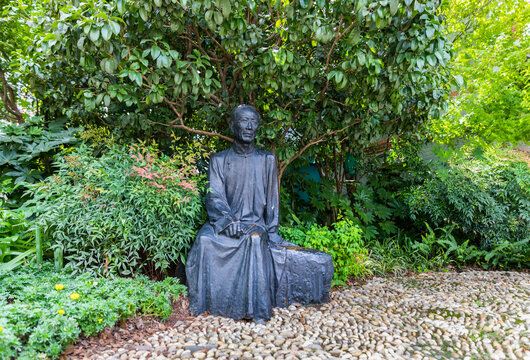 Shanghai, China - October 6, 2020: Bronze statue of Guo Moruo on Duolun Road, a pedestrian and cultural celebrity street in Hongkou., Shanghai, China. Famous Chinese archaeologist, historian, poet.