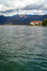 islands on Lake Maggiore surrounded by mountains on a cloudy day