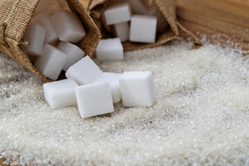 Sugar cubes on top of granulated sugar