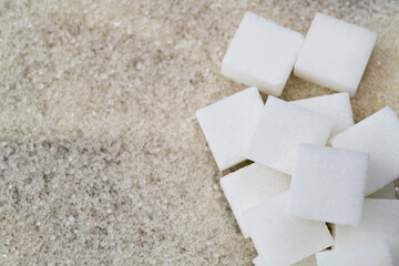 Sugar cubes on top of granulated sugar