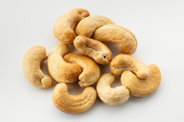 Dried cashew nuts. Macro shot. Raw snack. Pile cashew nuts without shell. Whole nut kernels