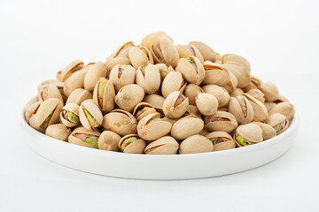 Salted Pistachios for Beer, Macro, Spin. Isolated Background of a Beer Snack of Salted Pistachio Nuts. Healthy Delicious Pistachios. Salted roasted pistachio macro