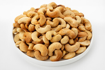 Dried cashew nuts. Macro shot. Raw snack. Pile cashew nuts without shell. Whole nut kernels