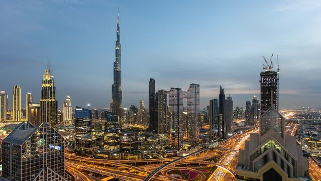 Dubai skyline time lapse from day to nigh with Burj Khalifa - aerial view, United Arab Emirates