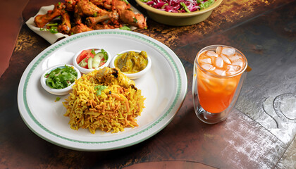 thai spicy curry with rice chicken and rice biryani, cold drink,meal ,plate salad, AI generated