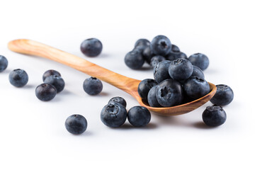 Fresh blueberries in wooden spoon