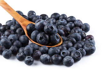 Fresh blueberries in wooden spoon