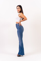 Brunette woman on a white background, casting studio photos, portrait in a white t-shirt in profile