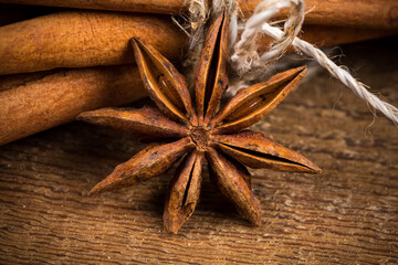 Close up of cinnamon sticks and star anise on wood