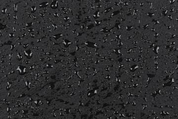 Water drops on dark stone