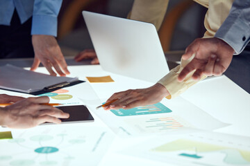 Team of developers working on startup project, creating ideas and analyzing market over modern office interior. Sprint planning