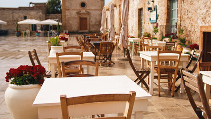 Fototapeta na wymiar Outdoor restaurant in a typical Italian village.