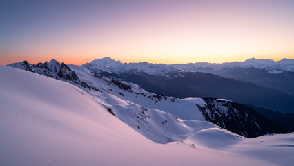 Beautiful mountainous landscape in winter at sunrise and view of the Mont Blanc. Sunrise colors, snow 