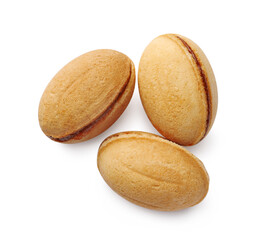 Delicious nut shaped cookie with boiled condensed milk on white background, top view