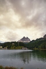 Obraz premium Beautiful landscape of a lake in Dolomites on a cloudy day