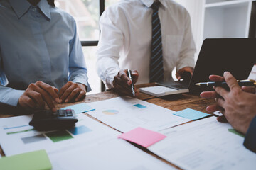 brainstorming group of business people Marketing plan research team concept, design, analysis, calculation Summarize the performance to prepare for the meeting. Paperwork on the desk at the office.