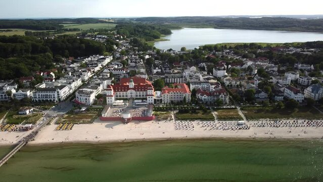Aerial view, shot by a drone, showing the seaside resort and sandy beach of Binz with the historic spa house and hotel, located on the Ruegen Island in Germany