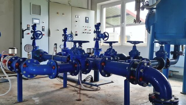 Drinking water pumping station inside a pumphouse facility - pan shot