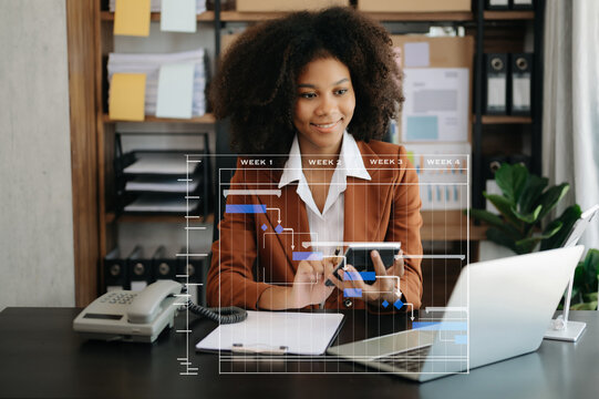 Project manager working and update tasks with milestones progress planning and Gantt chart scheduling diagram. business working with smart phone, tablet and laptop