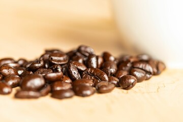 Closeup of a heap of roasted coffee beans.