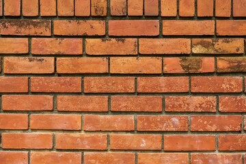 Stone wall texture made from red stiff stone