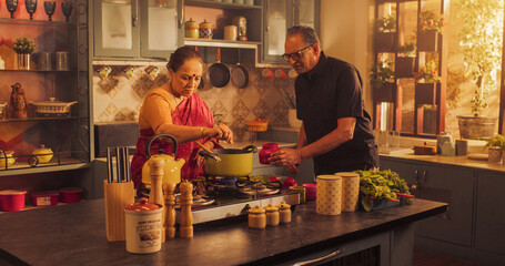Indian Couple Exploring Traditional Cooking: Preserving Culinary Heritage, Preparing Authentic Recipes with Love and Care. Sharing Cultural Traditions in the Kitchen. 