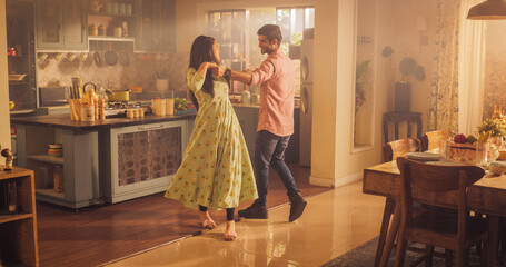 Young Couple Dancing and Having Fun in the Kitchen: Enjoying Each Other's Company and Playfully Moving to Music. With Joyful Laughter and Smiles, they Embrace the Music and Dance