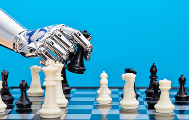 Robot hand holding chess pieces