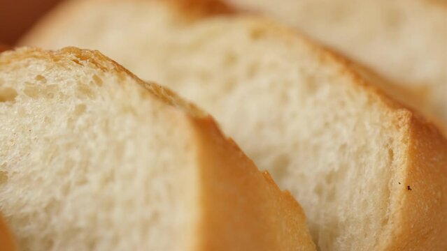 Sliced fresh crispy French baguette, slider shot