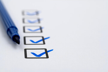 Blue pen marking on checklist sheet