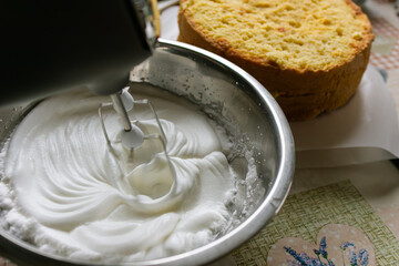 Mixer.Whipping dough.Liquid dough.Kitchen appliances.Cooking at home.Hobby.Cooking.Dough making.Whipping cream.Good mixer. Cooking a cake.Home cooking.Recipe.Kitchen device.mixing.whisk.Ingredients.