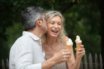 mature couple enjoying ice cream together