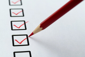 Red pen marking on checklist sheet