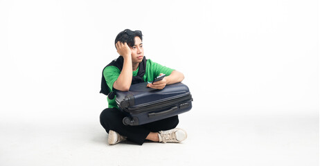 Youngman asian with luggage go on vacation weekend You can see attractions on your mobile phone. journey concept isolated background white