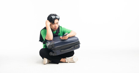 Youngman asian with luggage go on vacation weekend You can see attractions on your mobile phone. journey concept isolated background white