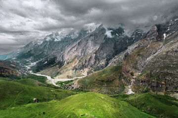 Fototapeta na wymiar Bolkar General view during spring, green grass and snowy peaks, mountain range in central anatolia