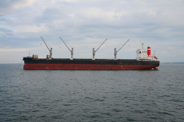Naklejka premium Large bulk carrier ship sailing in the Baltic sea. Freight transportation.