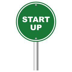 Green road sign with words Start Up on white background