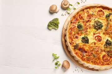 Delicious homemade vegetable quiche, mushrooms and broccoli on wooden table, flat lay. Space for text