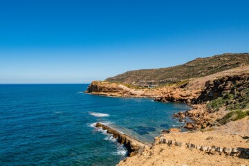 Fototapeta na wymiar Beautiful seascape with rocky cliffs on the coast of Korbous, Tunisia