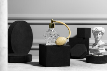 Stylish presentation of perfume bottle on light grey table