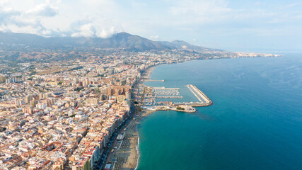 Obraz premium Fuengirola Spain, Aerial view on Coast of sea and buildings. Drone photo of coastal town