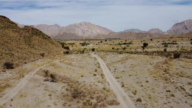 Aerial shot of car driving in between the mountains. Khuzdar balochistan