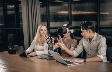 College students collaborate with research team to do experiment with educational robots. Wearing virtual reality goggle help learner to engage real, interacting situations with immersive experience.