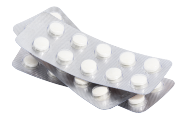 Stack of blister packs with round pills on a white isolated background