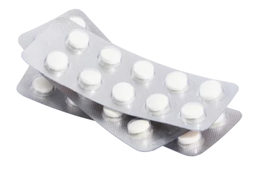 Fototapete Apotheke Stack of blister packs with round pills on a white isolated background