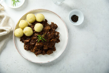 Homemade beef ragout with potato dumplings