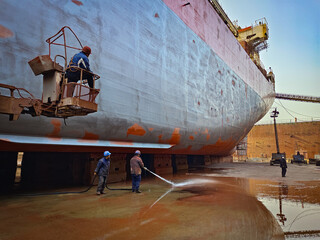A ship hull after sand blasting and painting in dry dock