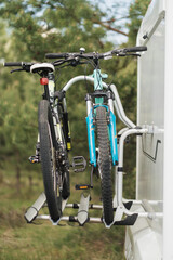 Fototapeta na wymiar Bicycles are mounted on the motorhome. The concept of travel